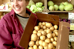 Lauren with potatoes bulk farmers market winter fall